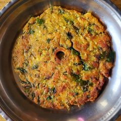 A picture of Leftover khichdi thalipeeth.