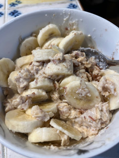 A picture of Oatmeal with Almond Milk and Banana 🍌.