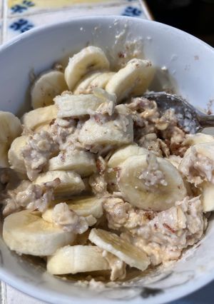 A picture of Oatmeal with Almond Milk and Banana 🍌.
