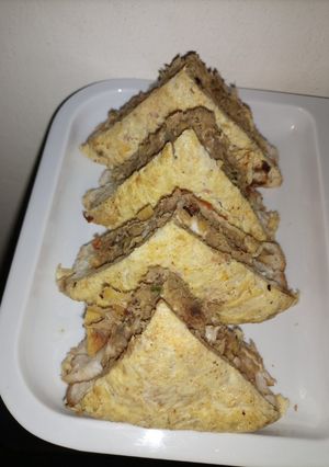 A picture of Egg Wrapped Shami Sandwich.