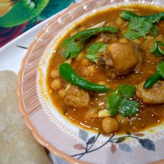 Chilli murgh cholay with puri A picture of Chilli murgh cholay with puri.