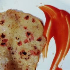 A picture of Tomato Uttapam.