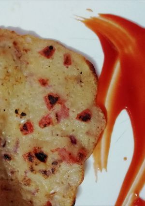 A picture of Tomato Uttapam.