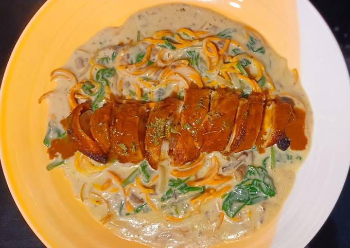Creamy mushroom carrot pasta with bacon-wrapped chicken breast