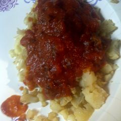 A picture of Dry fried cauliflower with Amatriciana sauce.