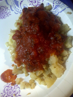 A picture of Dry fried cauliflower with Amatriciana sauce.
