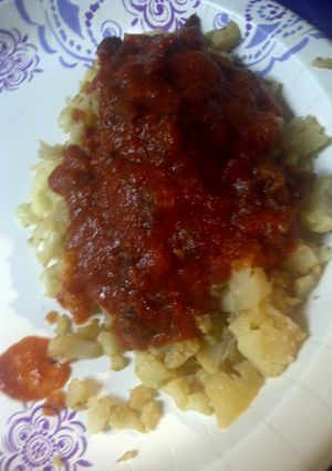 A picture of Dry fried cauliflower with Amatriciana sauce.