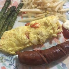 A picture of Mushroom omelet,asparagus and sausage.