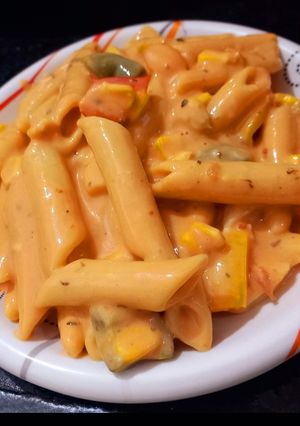 A picture of Penne pasta with cheese.
