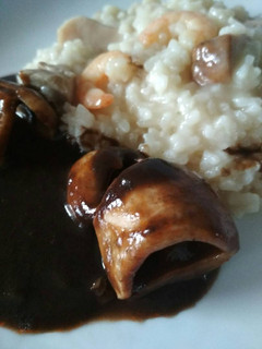 Una foto de Arroz tierra y mar con chipirones