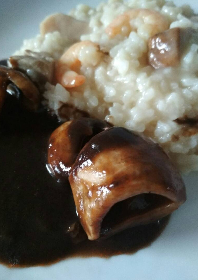 Una foto de Arroz tierra y mar con chipirones