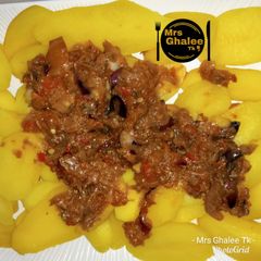 Boiled potatoes with tomatoes sauce A picture of Boiled potatoes with tomatoes sauce.