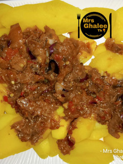 A picture of Boiled potatoes with tomatoes sauce.
