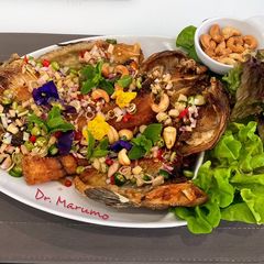 A picture of Fried Tilapia Fish with Lemongrass Salad.
