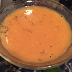 A picture of Red Lentils soup with vegetables.