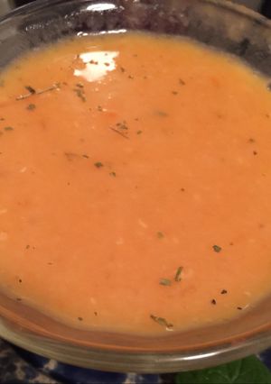 A picture of Red Lentils soup with vegetables.
