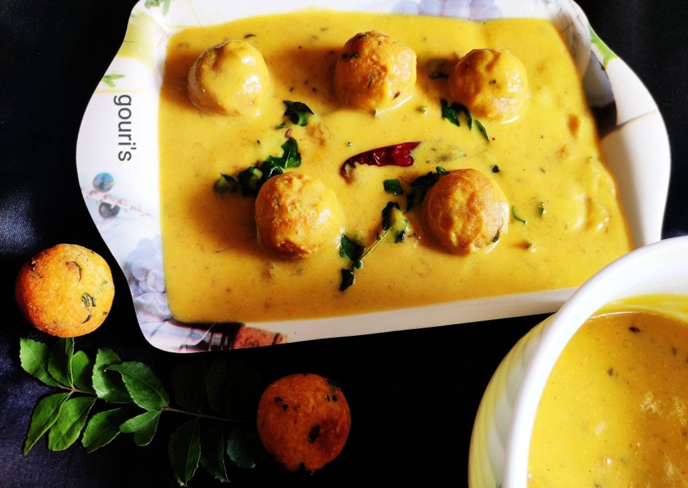 Raw mango kadhi and cauliflower pokoda