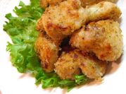 A picture of soup with bread crumbs