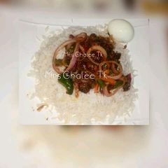 White rice with onion sauce and egg A picture of White rice with onion sauce and egg.