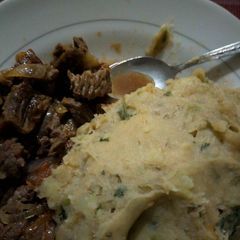 A picture of Mashed matoke served wid beef stew.