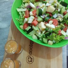 A picture of Mix Veggies salad 🥗 with orange 🍊 dressing.