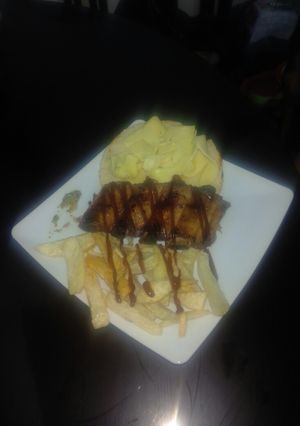 Una foto de Costillas a la BBQ en ahumador