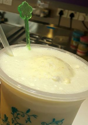 A picture of Badam Milk served with Ice cream.