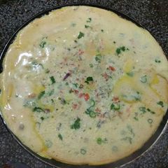 A picture of Half cook omlete.