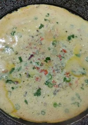 A picture of Half cook omlete.