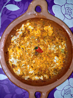 A picture of Tagine with Lamb Brain and Eggs.