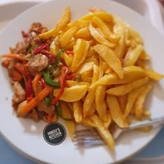 A picture of Chips with chicken veggies.