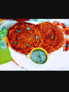 A picture of Tasty crisp soft Laccha Paratha with kasuri methi and sesame seeds.