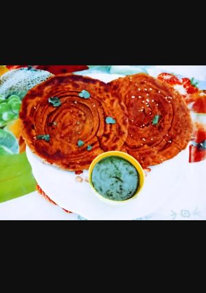 A picture of Tasty crisp soft Laccha Paratha with kasuri methi and sesame seeds.