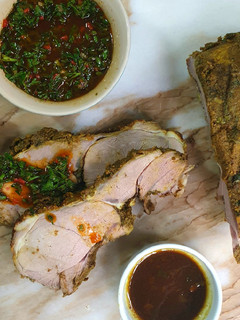 A picture of Roasted leg of lamb and chimichurri.