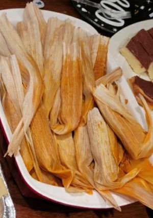 A picture of Beef Tamales with Red Chile Sauce.