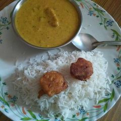 Kadhi Pakora with boiled Rice A picture of Kadhi Pakora with boiled Rice.