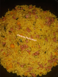 A picture of Fried Rice with Sausages.