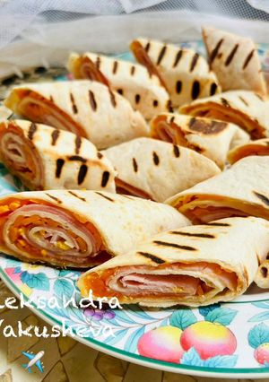 A picture of Tortilla Rolls with Ham and Cheese.