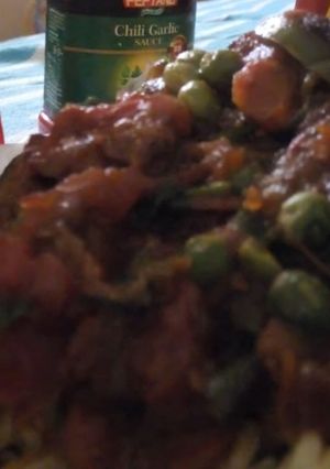 A picture of Stewed carrots and peas.
