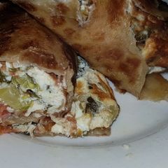 A picture of Moist cherry tomato sukuma wiki egg wrap.