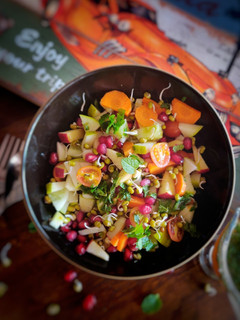 A picture of Sprouts and fruits salad.