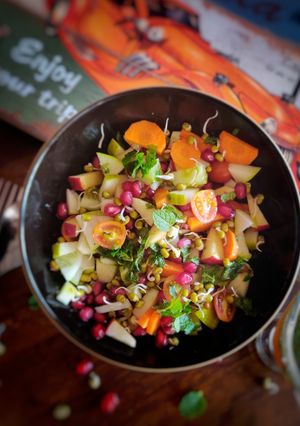 A picture of Sprouts and fruits salad.