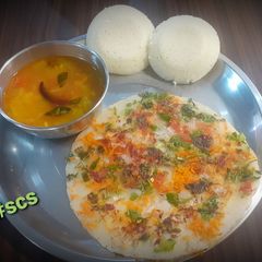 A picture of Oats Semolina Uttapam with idli and Sambhar.