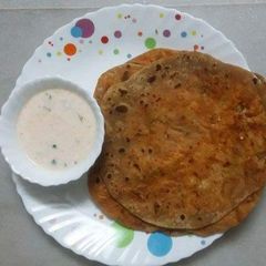 A picture of Paneer Paratha with Carrot Raita.
