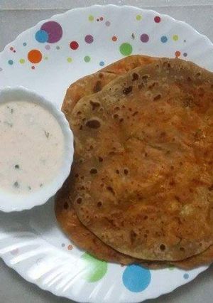 A picture of Paneer Paratha with Carrot Raita.