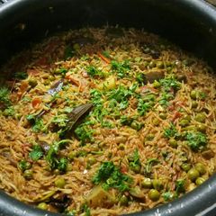 A picture of Vangi bhat (Brinjal masala rice).
