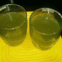 A picture of Lime soda with mint.