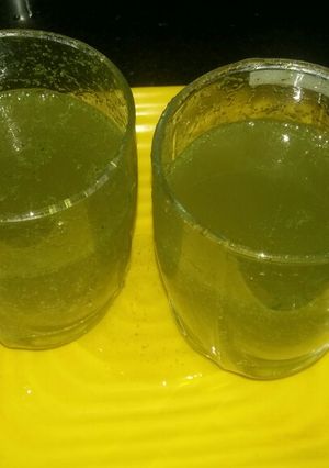 A picture of Lime soda with mint.