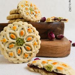 A picture of Kerman Kolompeh (Traditional Persian Date-Filled Cookies).
