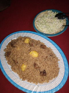 A picture of Pilau and salad.